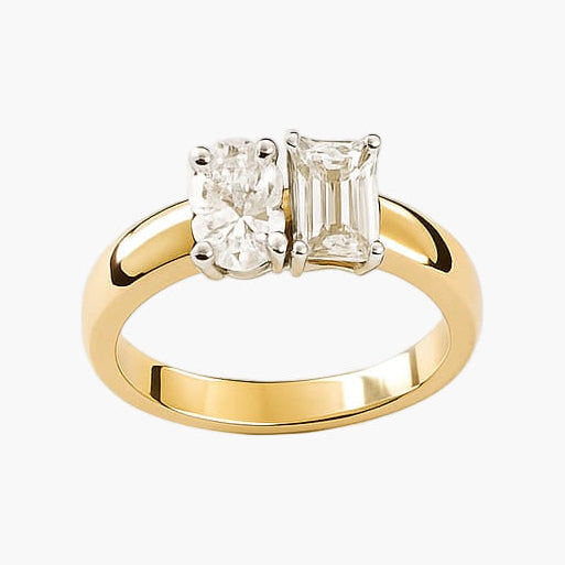 Gold ring with two diamonds on a white background