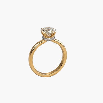 Gold ring with a diamond on a white background