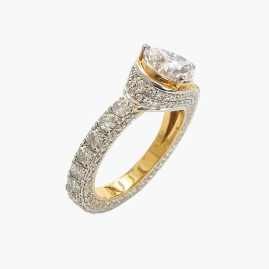 Gold and silver ring with a diamond on a white background