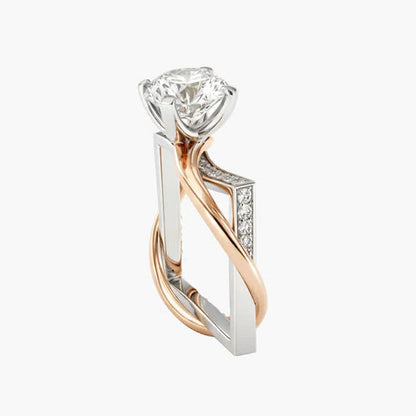 Diamond ring with a two-tone rose gold and silver design on a white background