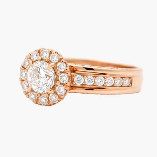 Rose gold ring with a large diamond and smaller diamonds on a white background