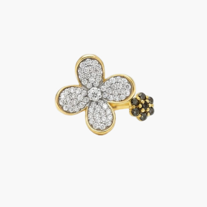 Gold and diamond flower-shaped earring on a white background