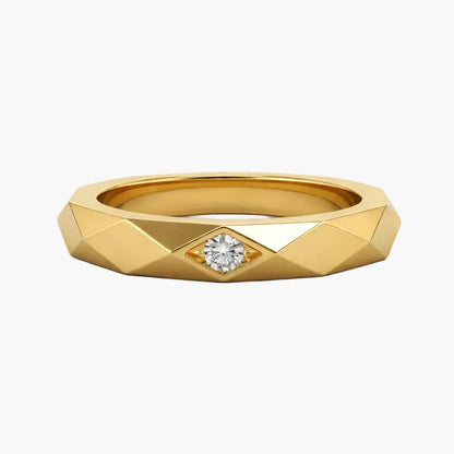 Gold ring with a diamond on a white background