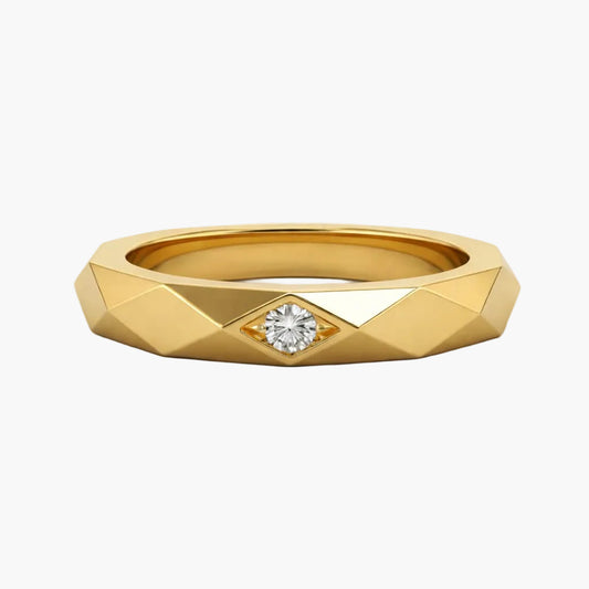 Gold ring with a diamond on a white background