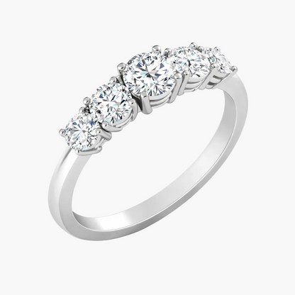Diamond ring with four clear gemstones on a white background