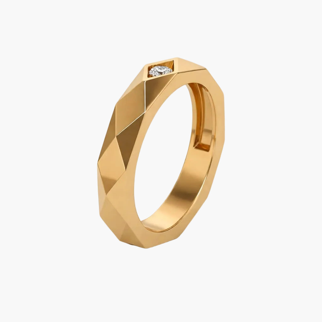 Gold ring with a diamond on a white background