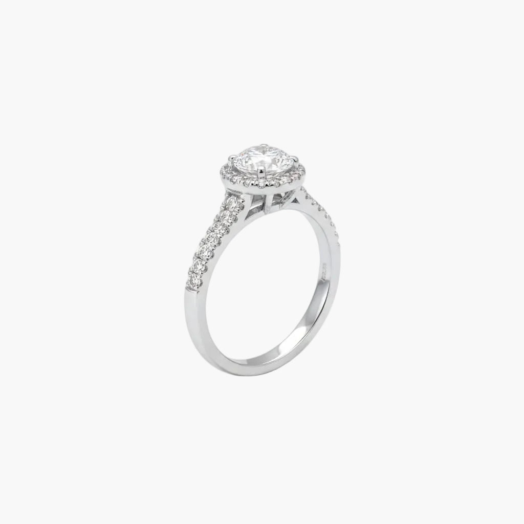 Silver ring with a diamond on a white background