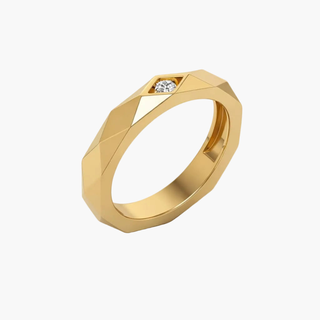 Gold ring with a diamond on a white background