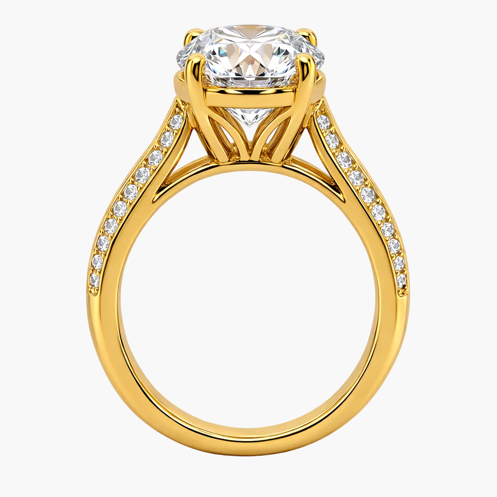 Gold ring with a large diamond and smaller diamonds on the band against a white background