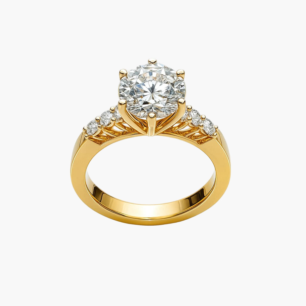 Gold ring with a large diamond and smaller diamonds on the band against a white background