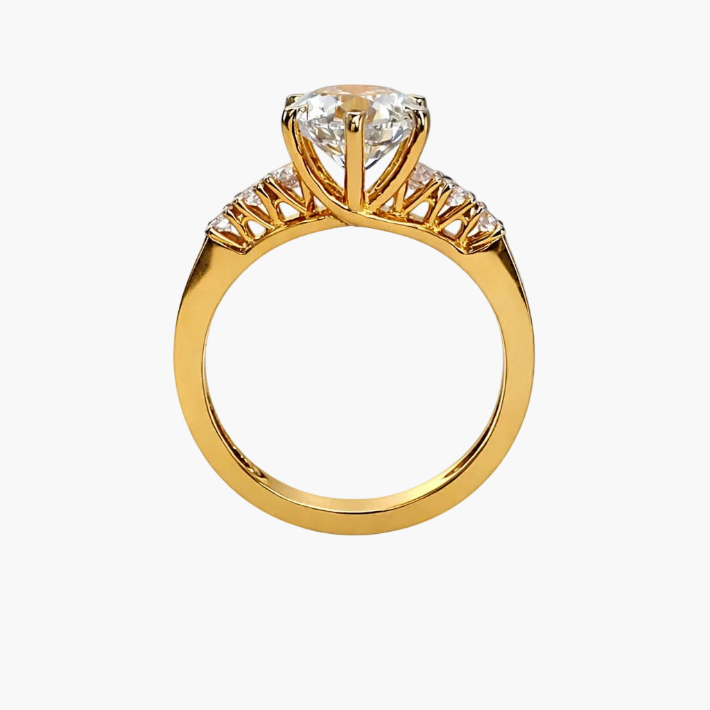 Gold ring with a diamond on a white background