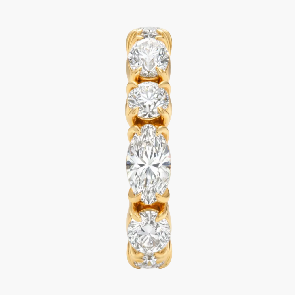 Gold and diamond ring on a white background