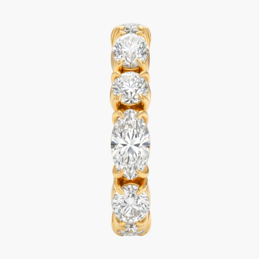 Gold and diamond ring on a white background