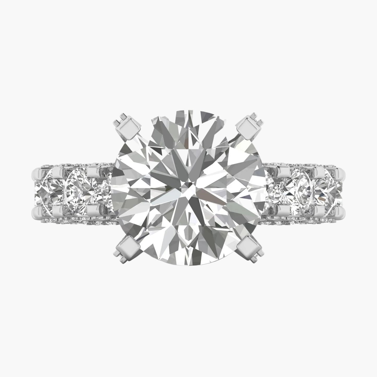 Diamond ring with a central gemstone and two smaller stones on a white background