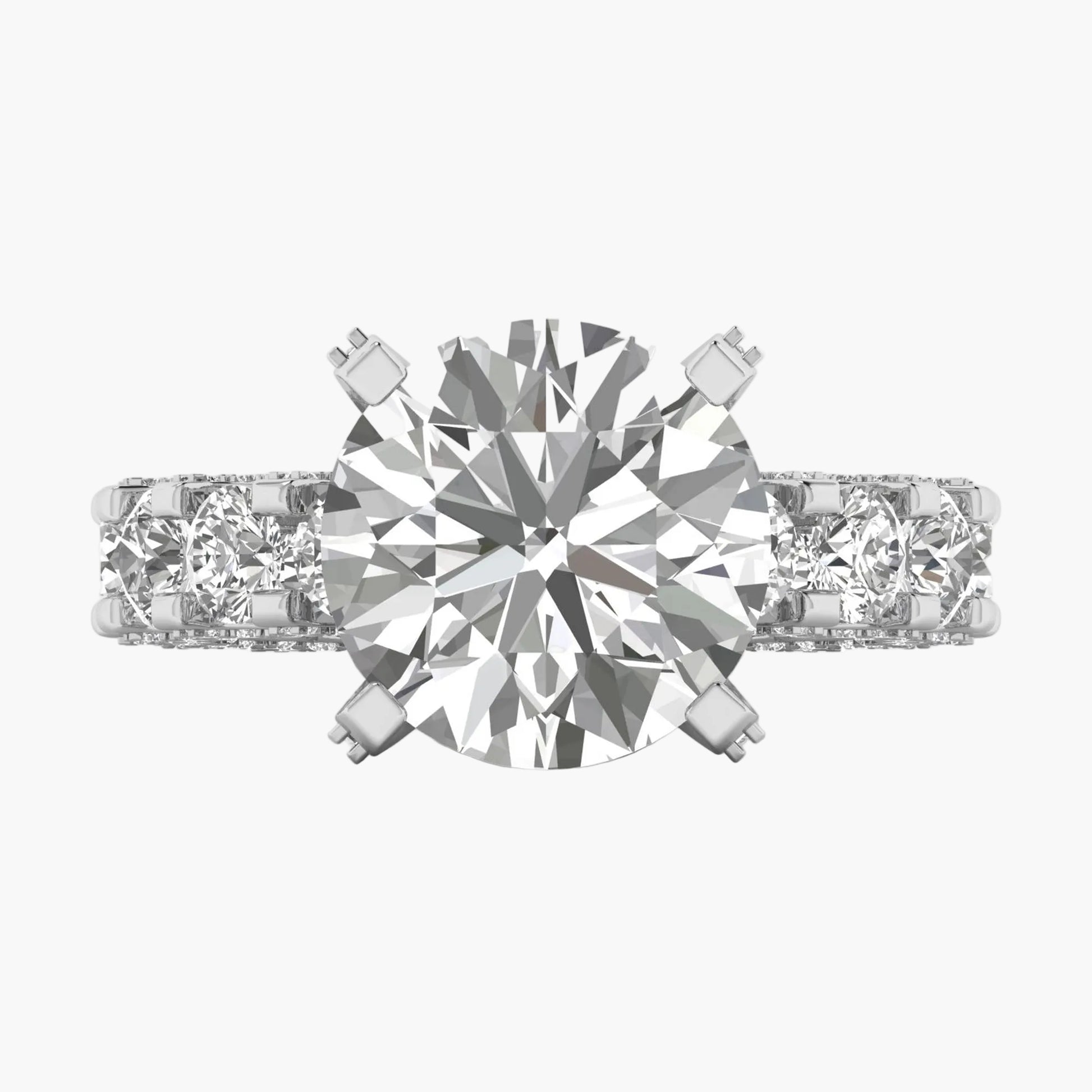 Diamond ring with a central gemstone and two smaller stones on a white background