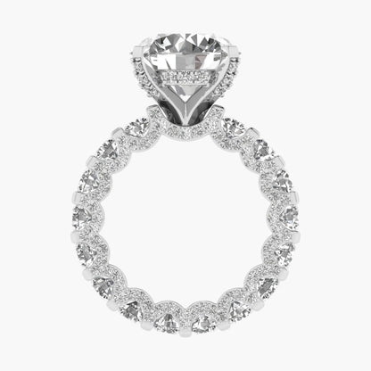Diamond ring with a heart-shaped center stone on a white background