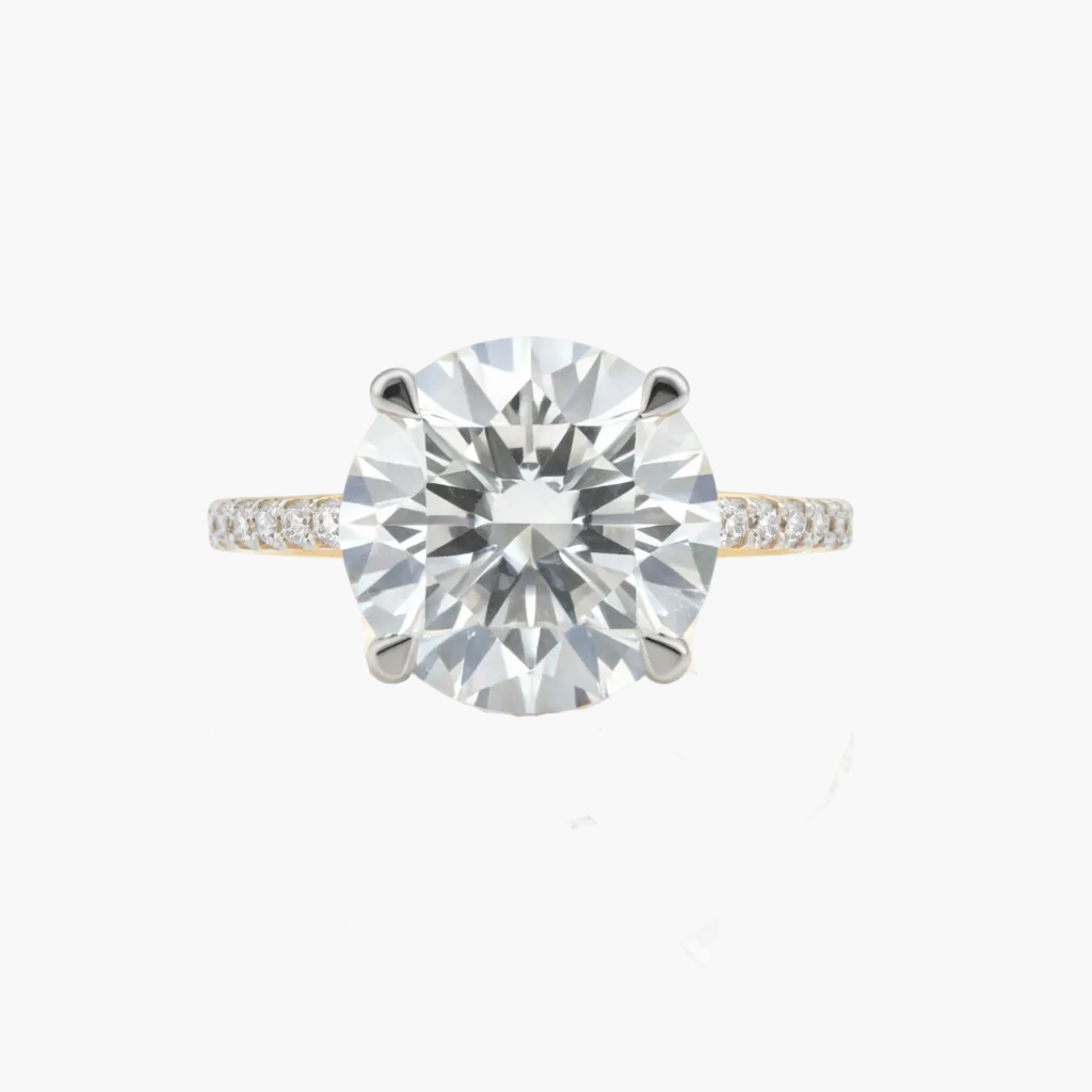 Diamond ring with a large central gemstone on a white background