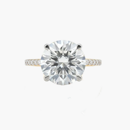 Diamond ring with a large central gemstone on a white background