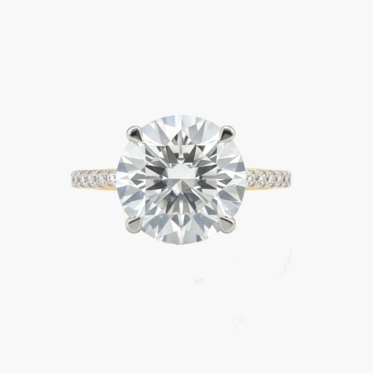 Diamond ring with a large central gemstone on a white background