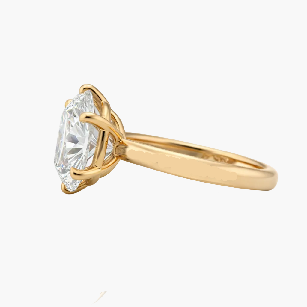 Gold ring with a large diamond on a white background