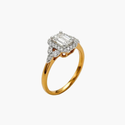 Gold ring with diamond accents on a light gray background