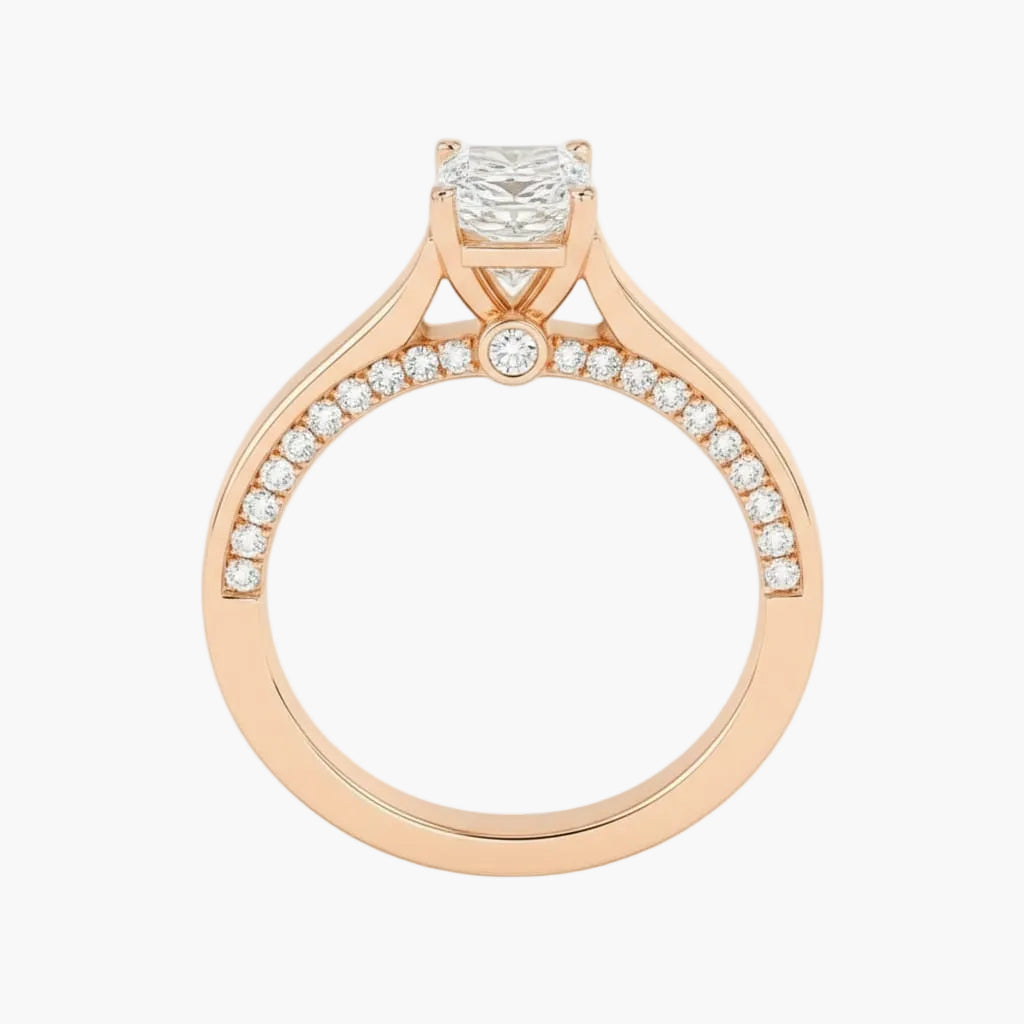 Rose gold ring with a diamond on a white background