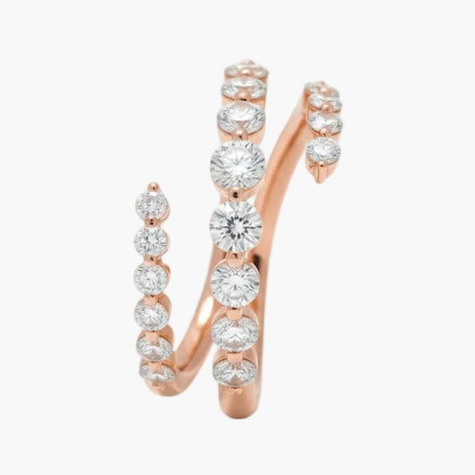 Rose gold ring with diamond stones on a white background