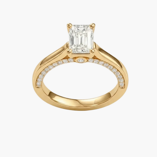Gold ring with a diamond on a white background