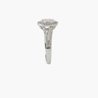 Silver ring with a diamond on a light gray background