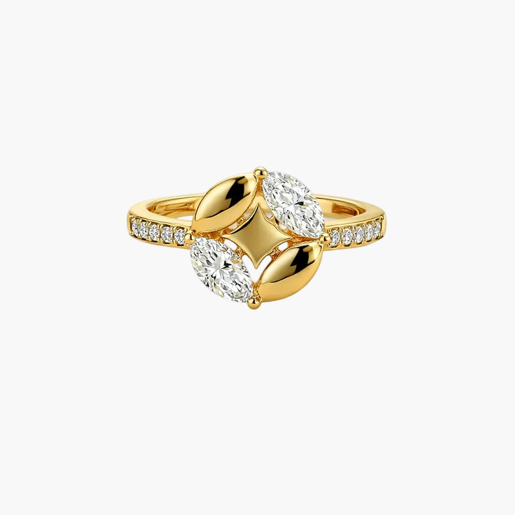 Gold ring with diamond accents on a white background