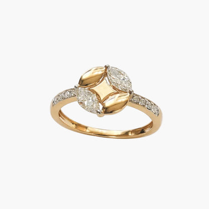 Gold ring with diamond accents on a white background