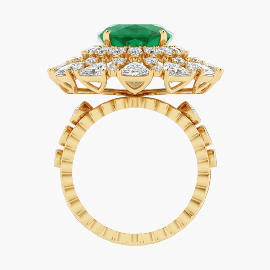 Gold ring with a green gemstone and diamond accents on a white background