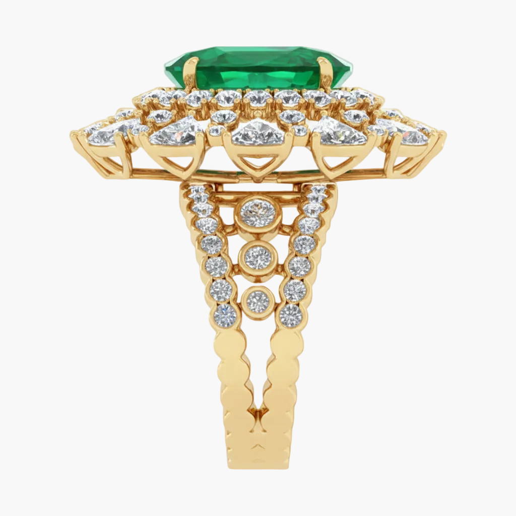 Gold ring with emerald and diamonds on a white background