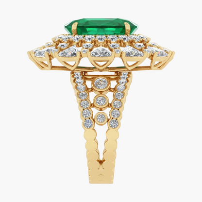 Gold ring with emerald and diamonds on a white background