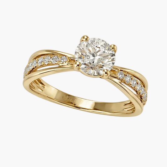 Gold ring with a diamond on a white background