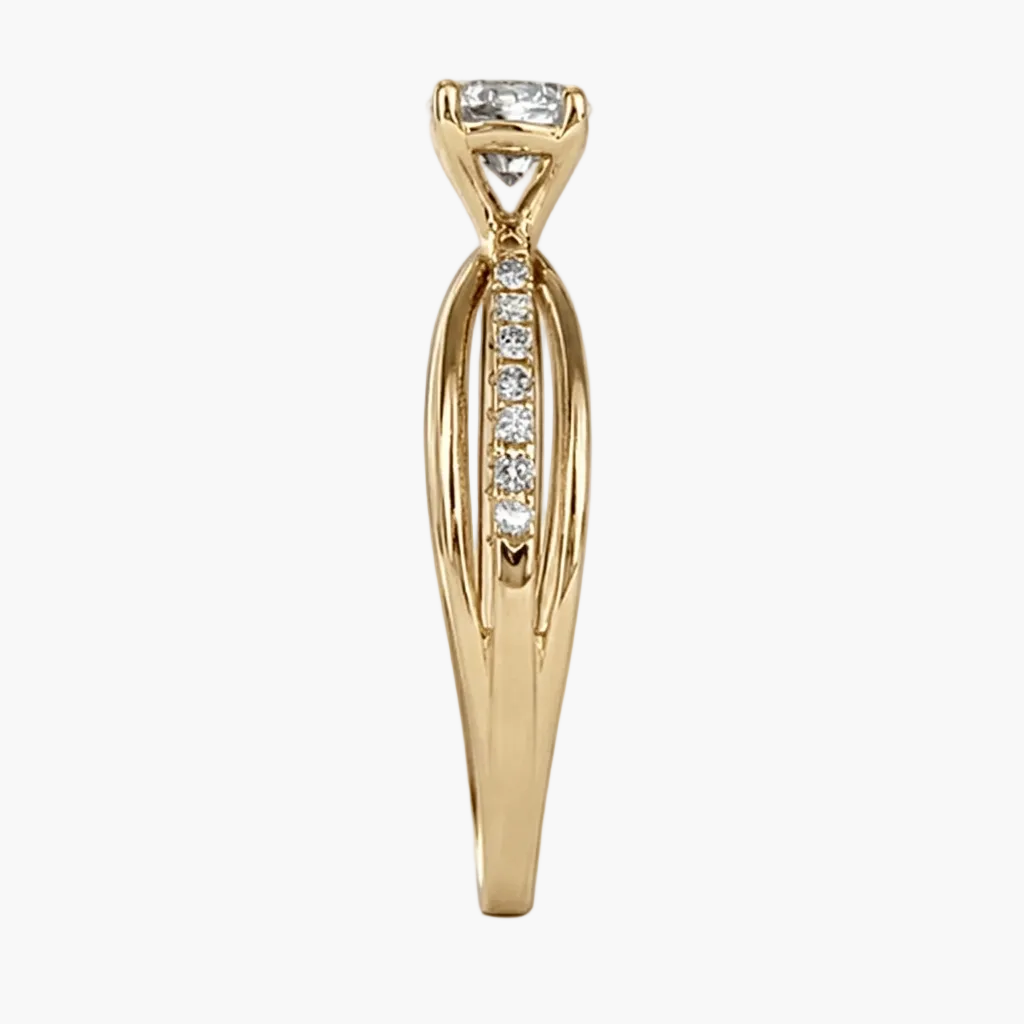Gold ring with diamond accents on a white background