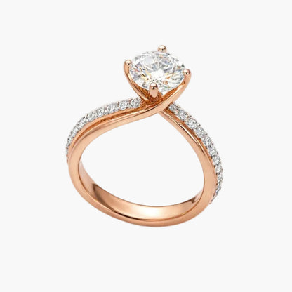 Rose gold ring with a heart-shaped diamond on a white background