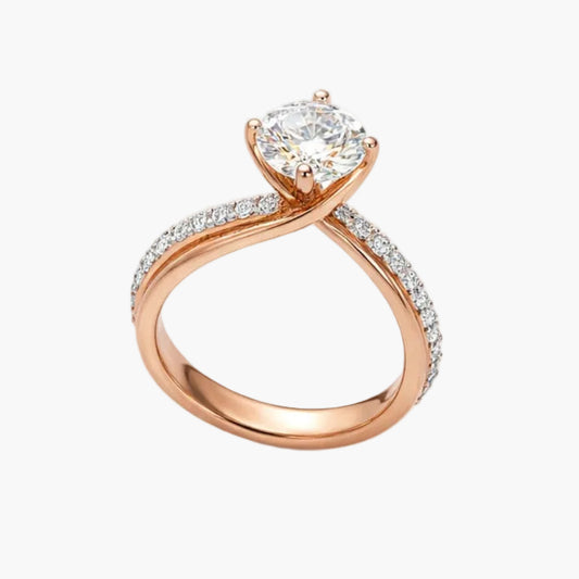 Rose gold ring with a heart-shaped diamond on a white background