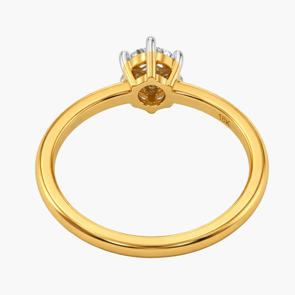 Gold ring with diamond setting on a white background