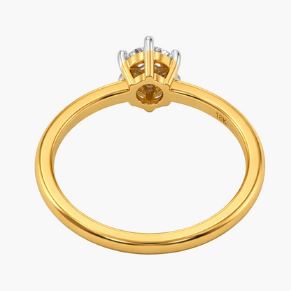 Gold ring with diamond setting on a white background