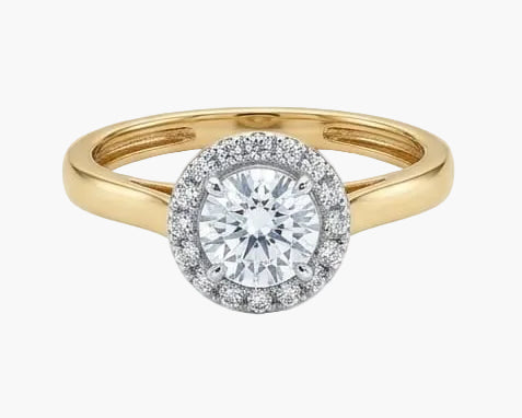 Gold and silver ring with a diamond on a white background
