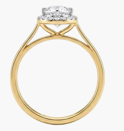 Gold ring with a diamond on a white background