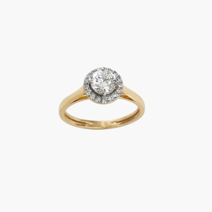 Gold ring with a diamond on a white background