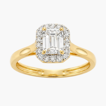 Gold ring with emerald-cut diamond and smaller diamonds on a white background