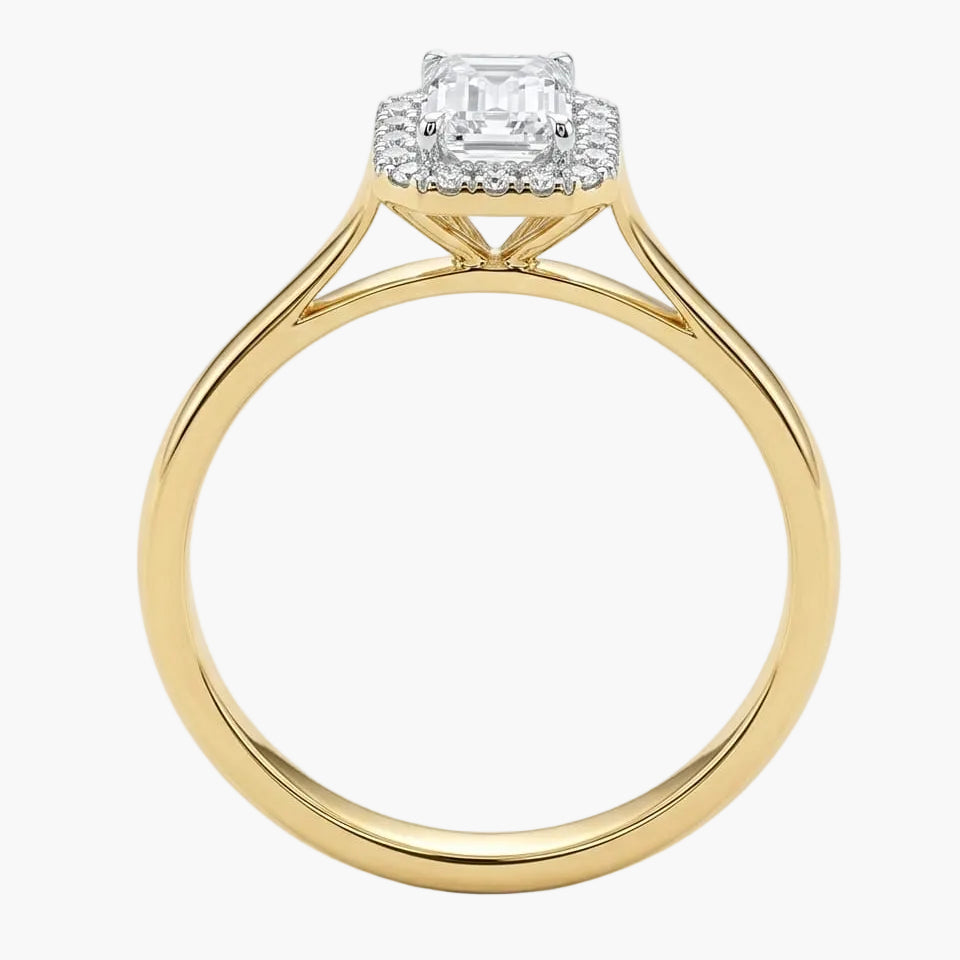 Gold ring with a diamond on a white background