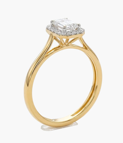 Gold ring with a diamond on a white background