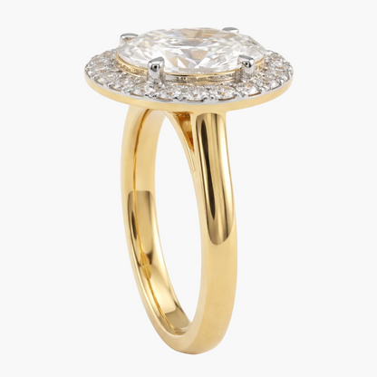 Gold ring with a diamond on a white background