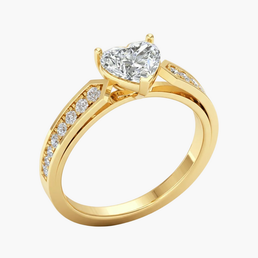 Gold ring with a large diamond and smaller diamonds on the band against a white background