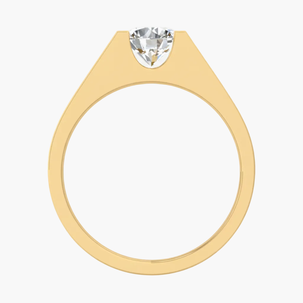 Gold ring with a heart-shaped diamond on a white background