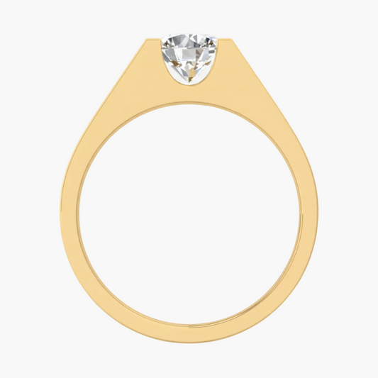 Gold ring with a heart-shaped diamond on a white background